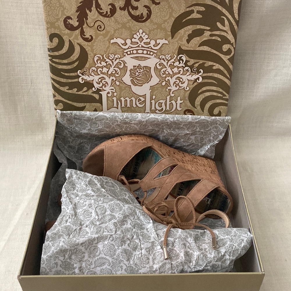 Women’s tan suede and cork wedge. Gently used with box
